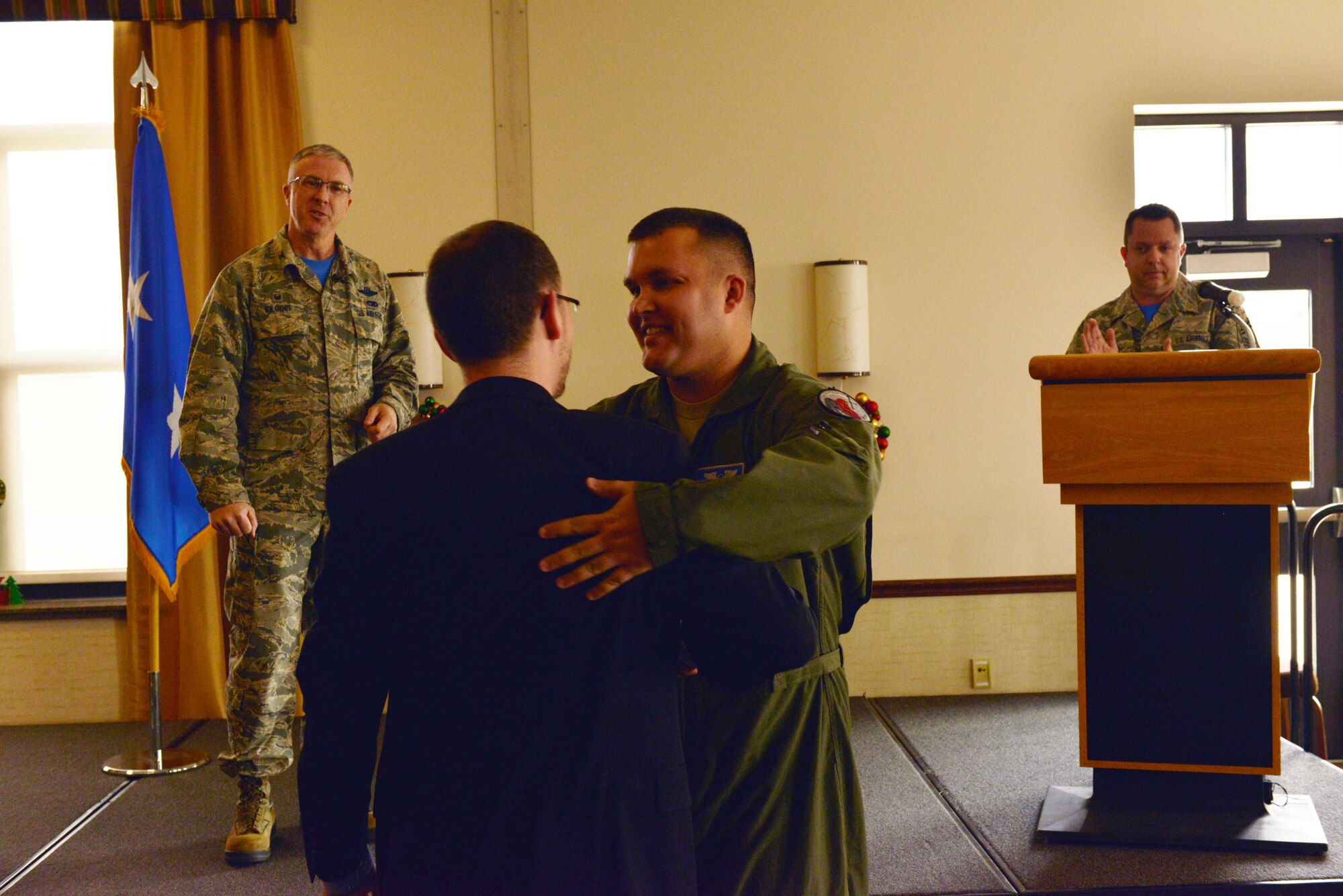 Jack Ewald embraces New York Air National Guardsman Tech. Sgt. Jason Oehlbeck as they meet for the first time at Niagara Falls Air Reserve Station December 6, 2015. Oehlbeck performed CPR for 18 minutes to save the life of Ewald at a hotel in Syracuse, NY. (U.S. Air National Guard Photo/Senior Master Sgt. Ray Lloyd)