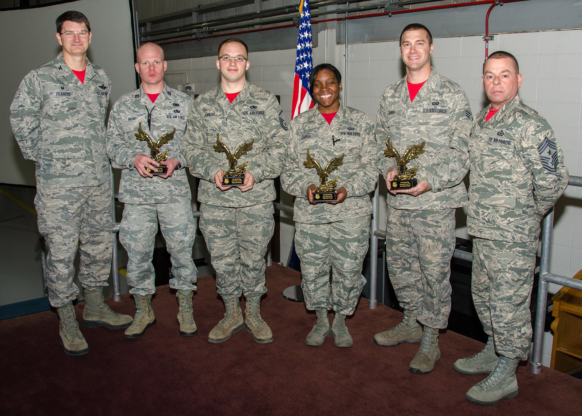 During the end-of-year commander’s call on December 6, 2015 at Whiteman Air Force Base, Missouri,131st Bomb Wing commander Col. Mike Francis recognized the wing’s Outstanding Airmen of the Year. Pictured left to right:  Col Mike Francis; Company Grade Officer of the Year Capt. Matt Payne, 131st Maintenance Group; Senior Noncommissioned Officer of the Year Master Sgt. John Ilnicky, 131st Maintenance Group; Noncommissioned Officer of the Year Staff Sgt. Staci Cooper, 131st Operations Group; Airman of the Year Senior Airman Nathan Dampf, 131st Bomb Wing staff, and 131st Bomb Wing Command Chief Master Sgt. Paul Carney.  Not pictured:  First Sergeant of the Year Master Sgt. Jason Henke, 157th Air Operations Group;
Field Grade Officer of the Year Lt. Col. Michael Miller, 157th Air Operations Group. (U.S. Air National Guard photo by Airman 1st Class Halley Burgess)
