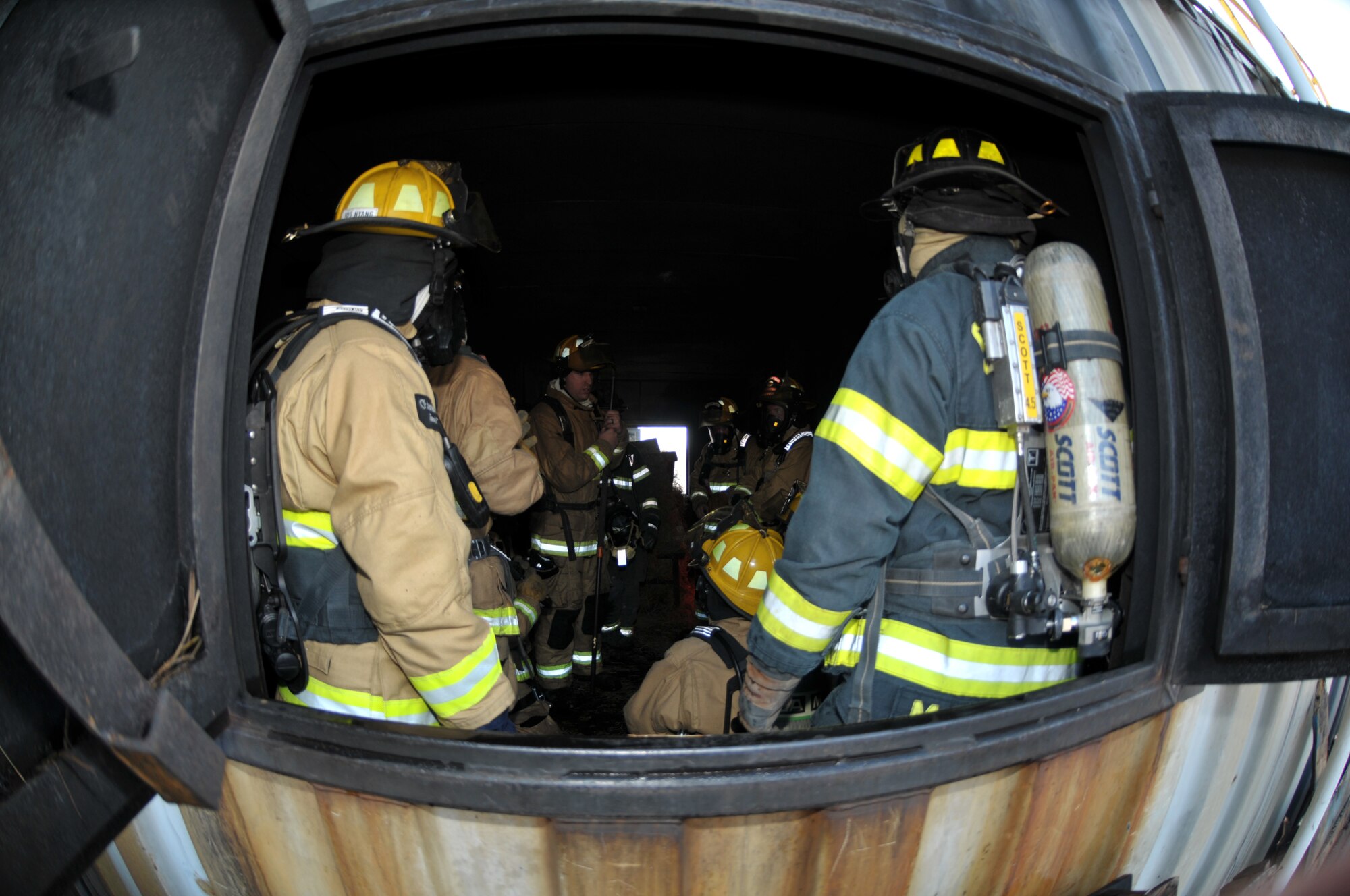 Tech. Sgt. Joshua Meyers, 109th Fire Department training officer, briefs participants on proper procedure during a live fire exercise in Ballston Spa, New York, on Dec. 5, 2015. (U.S. Air National Guard photo by Staff Sgt. Ben German/Released)