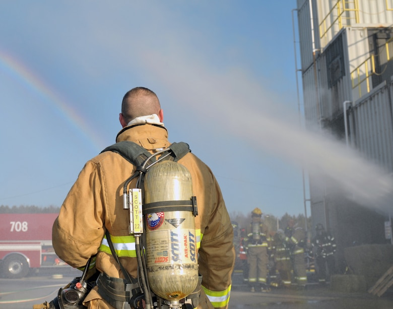 Tech. Sgt. Brian Devlin, 109th Fire Department station captain, looks on during a live fire exercise in Ballston Spa, New York, on Dec. 5, 2015. (U.S. Air National Guard photo by Staff Sgt. Ben German/Released)