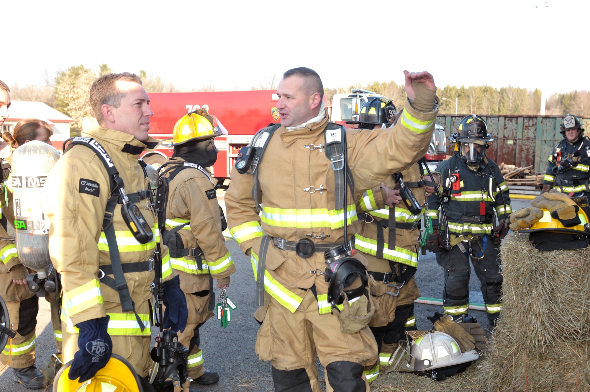 Tech. Sgt. Brian Devlin, 109th Fire Department station captain, briefs Lt. Col. Robert Donaldson, 109th Civil Engineer Squadron commander, on exercise protocols during a live fire exercise in Saratoga, New York, on Dec. 5, 2015. (U.S. Air National Guard photo by Staff Sgt. Ben German/Released)