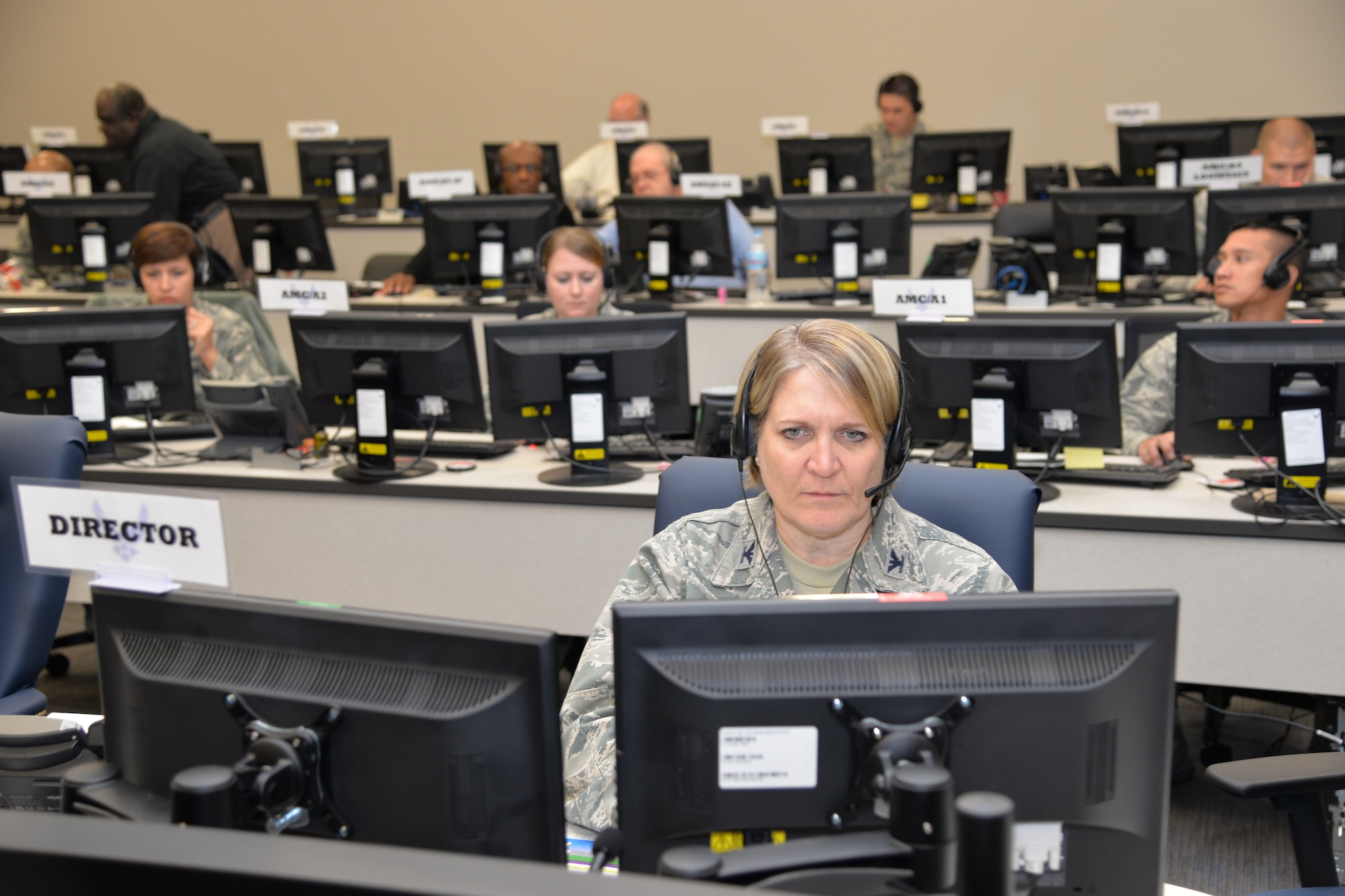 Col. Constance Jenkins, Air Mobility Command Reserve Advisor to the Director of Logistics, Engineering and Force Protection, works in the AMC and 18th Air Force Crisis Battle Staff as Director during Exercise Global Thunder/Vigilant Shield at 18th AF headquarters on Scott Air Force Base, Nov. 5, 2015. The Crisis Battle Staff is a collection of experts drawn from across AMC and 18th AF that activates on a round-the-clock basis to address a specific crisis. The CBS team is supposed to be fully functional within an hour of being recalled to support the 18th AF commander during crises ranging from natural disasters to nuclear war. (U.S. Air Force photo by Master Sgt. Thomas J. Doscher)