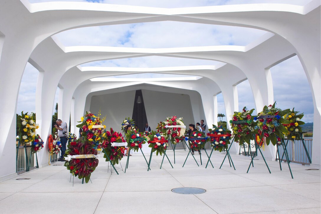 Wreaths adorn the USS Arizona Memorial on Joint Base Pearl Harbor-Hickam, Hawaii, Dec. 7, 2015, where a remembrance ceremony was held to honor survivors and those who lost their lives in the attacks on Pearl Harbor 74 years ago. U.S. Navy photo by Petty Officer 2nd Class Jeff Troutman