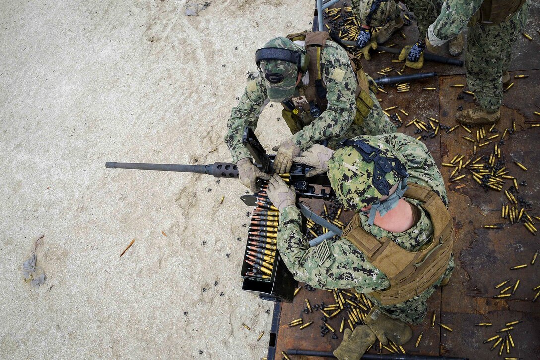 U.S. Navy sailors participate in a .50-caliber machine gun qualification course as part of deployment training in the 5th Fleet area of Operations, Nov.28, 2015. The sailors assigned to Commander, Task Group 56.11. U.S. Navy photo by Petty Officer 3rd Class Jonah Stepanik