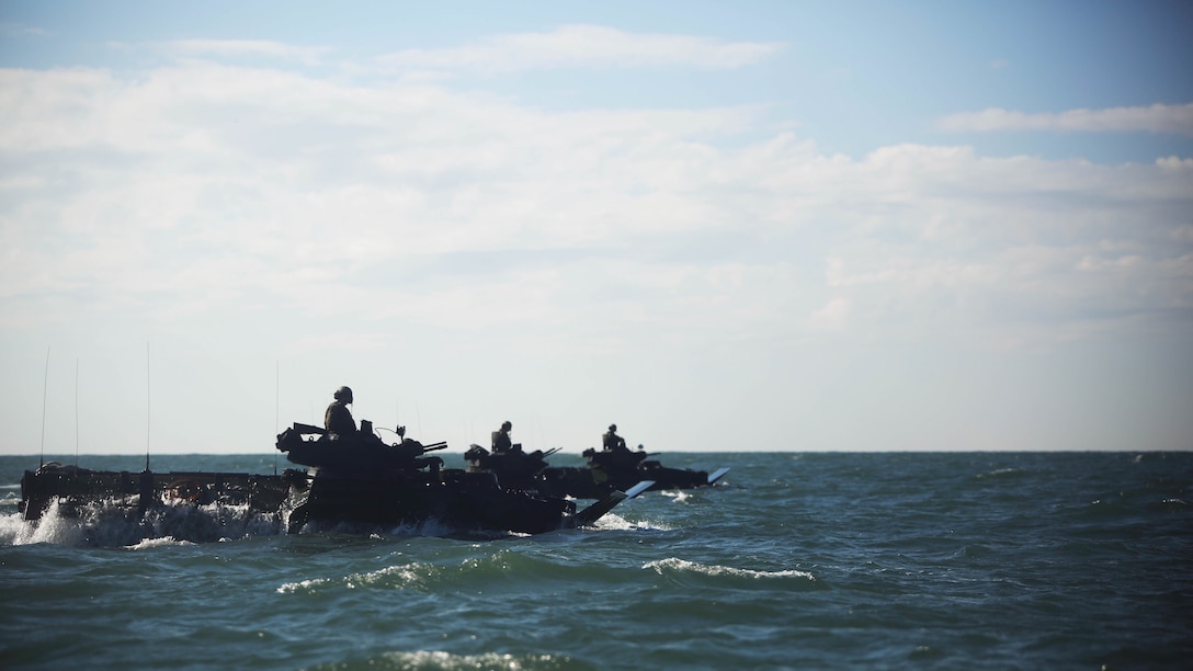 Amphibious Assault Vehicles with Alpha Company, 2nd Assault Amphibian Battalion prepare themselves before beginning beach operations on Marine Corps Base Camp Lejeune, N.C. Dec. 5, 2015. The unit conducted company-level maneuvers on land and at sea in preparation for future operations.