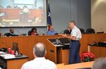 Col. Matt Isler, 12th Flying Training Wing commander, addresses the Live Oak City Council to answer questions about the Joint Land Use Study during its meeting Dec. 8, 2015.  The council voted 5-0 to adopt the study, ensuring joint development planning and compatible land use between the city and Joint Base San Antonio-Randolph.