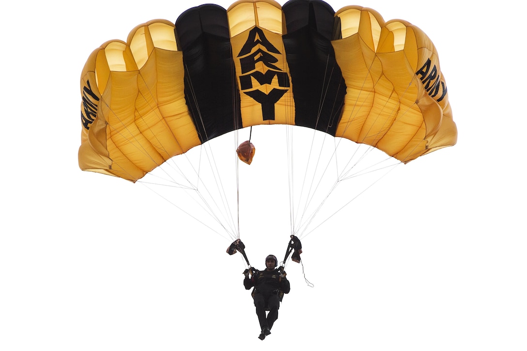 A U.S. Army Special Operations Forces parachute team member descends toward Luzon drop zone during the 18th Annual Randy Oler Memorial Operation Toy Drop on Camp Mackall, N.C., Dec. 7, 2015. U.S. Air Force photo by Staff Sgt. Douglas Ellis