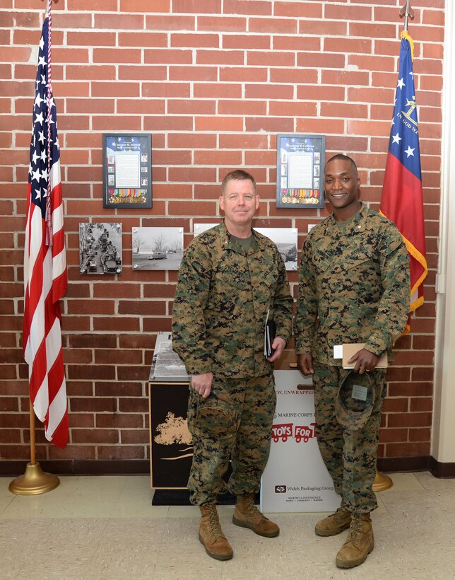 Base officials welcome Marine Corps Installations East’s command chaplain, Capt. Thomas Stewart (left), U.S. Navy, based out of Camp Lejeune, N.C., for his first visit to Marine Corps Logistics Base Albany, Dec. 8. According to Lt. Col. Nathaniel Robinson (right), executive officer, MCLB Albany, Stewart’s visit was an orientation to the base, the leadership team, the Chapel of the Good Shepherd and some of the installation’s other amenities. 
