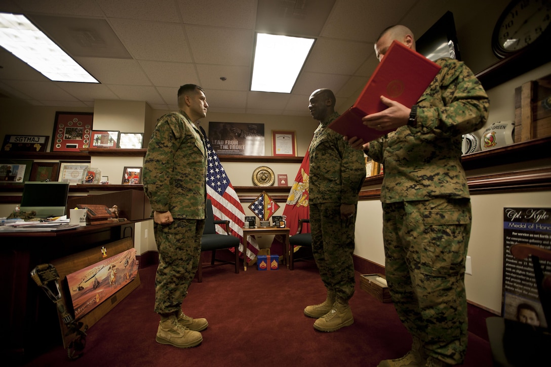 U.S. Marine Corps Gunnery Sgt. Jorge Valdez is awarded the Navy Commendation Medal by the 18th Sergeant Major of the Marine Corps, Ronald L. Green, at the Pentagon, Arlington, VA, Dec. 9, 2015. (U.S. Marine Corps photo by Sgt. Melissa Marnell, Office of the Sergeant Major of the Marine Corps/Released)