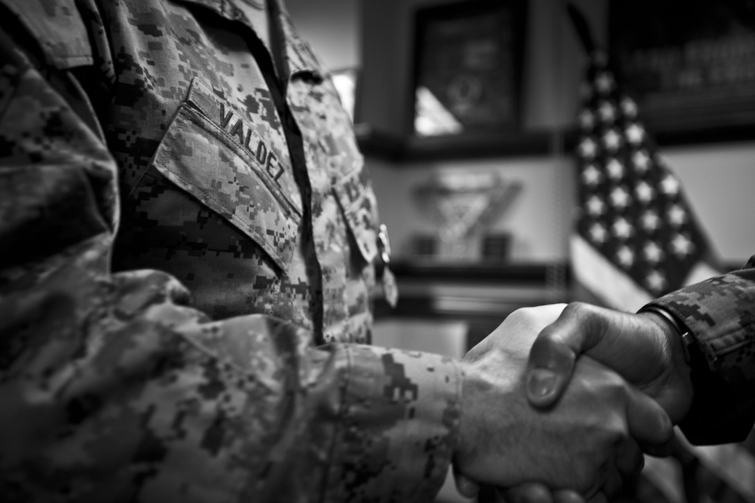 U.S. Marine Corps Gunnery Sgt. Jorge Valdez is awarded the Navy Commendation Medal by the 18th Sergeant Major of the Marine Corps, Ronald L. Green, at the Pentagon, Arlington, VA, Dec. 9, 2015. (U.S. Marine Corps photo by Sgt. Melissa Marnell, Office of the Sergeant Major of the Marine Corps/Released)