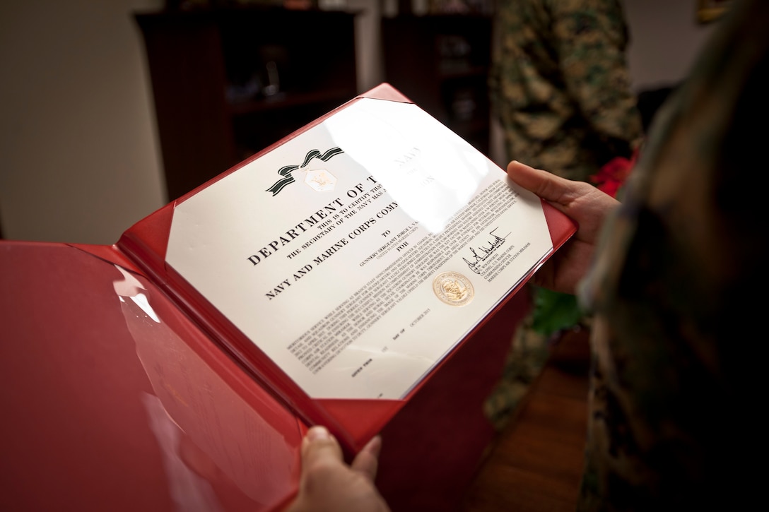 U.S. Marine Corps Gunnery Sgt. Jorge Valdez is awarded the Navy Commendation Medal by the 18th Sergeant Major of the Marine Corps, Ronald L. Green, at the Pentagon, Arlington, VA, Dec. 9, 2015. (U.S. Marine Corps photo by Sgt. Melissa Marnell, Office of the Sergeant Major of the Marine Corps/Released)