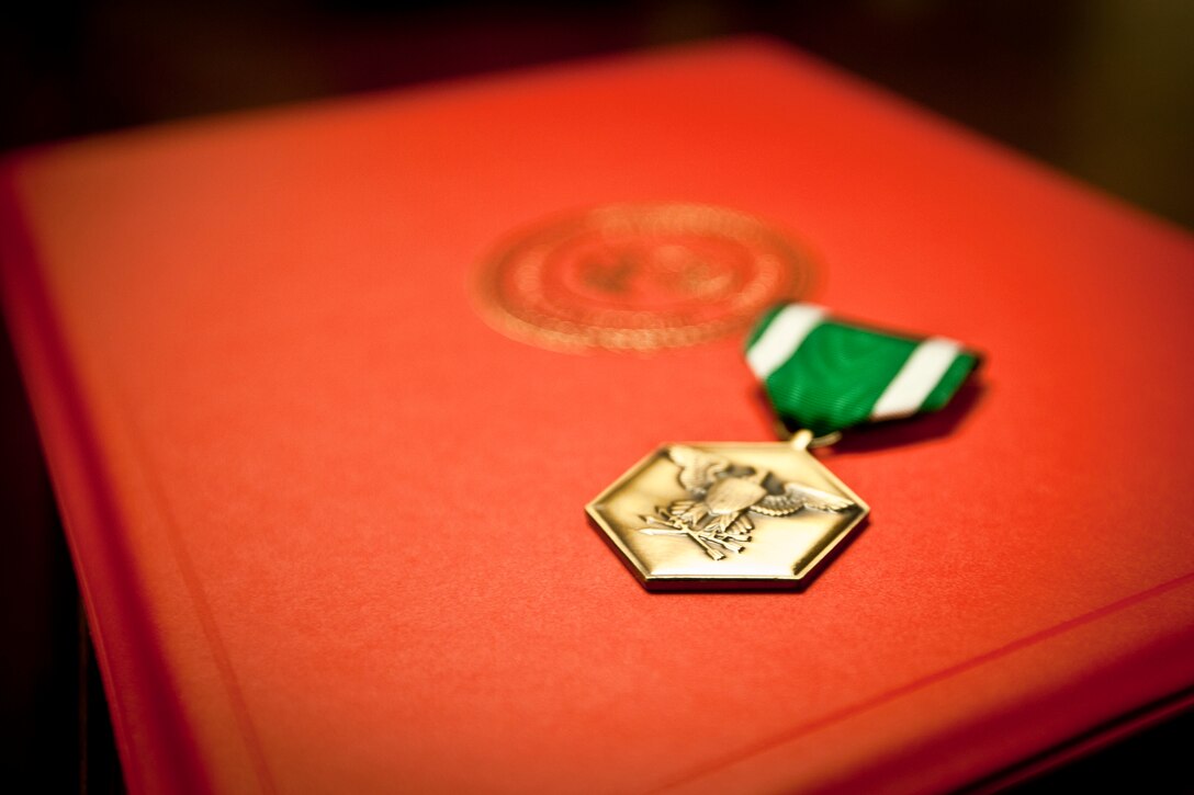 U.S. Marine Corps Gunnery Sgt. Jorge Valdez is awarded the Navy Commendation Medal by the 18th Sergeant Major of the Marine Corps, Ronald L. Green, at the Pentagon, Arlington, VA, Dec. 9, 2015. (U.S. Marine Corps photo by Sgt. Melissa Marnell, Office of the Sergeant Major of the Marine Corps/Released)
