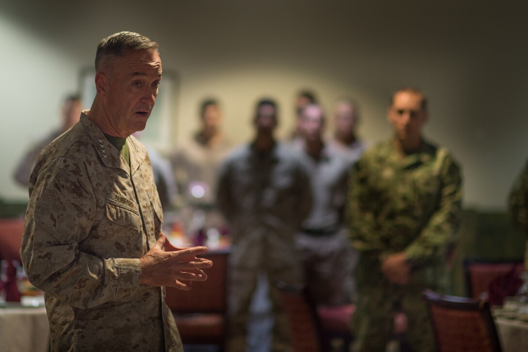 U.S. Marine Corps Gen. Joseph F. Dunford Jr., chairman of the Joint Chiefs of Staff, talks with U.S. service members at Naval Support Activity Bahrain, Dec. 7, 2015. The chairman and the 2015 USO Holiday Tour were visiting deployed service members and their families to express the country's gratitude for their service. DoD photo by D. Myles Cullen