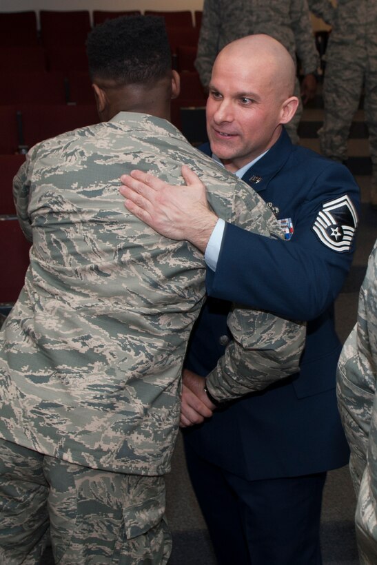 U.S. Air Force Senior Master Sgt. Christopher D. Kaleta greets a well-wisher after his retirement ceremony, December 5, 2015 on Barksdale Air Force Base, La. Kaleta is the 307th Logistics Readiness Vehicle Management Flight Chief and is retiring from the Air Force Reserve after more than 20 years of military service. (U.S. Air Force photo by Senior Airman Callie Ware/ Released)
