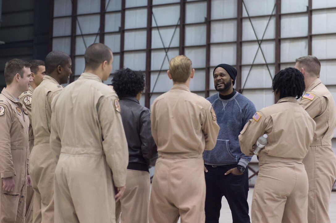 Comedian Sydney Castillo talks with service members during a visit by the 2015 USO Holiday Tour to Bagram Airfield, Afghanistan, Dec. 8, 2015. USO entertainers were traveling to various locations to visit deployed service members. DoD photo by D. Myles Cullen