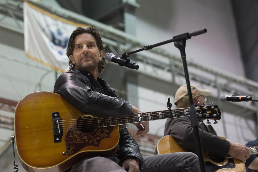 Singer/songwriters Brett James and Billy Montana perform during a visit by the 2015 USO Holiday Tour to Bagram Airfield, Afghanistan, Dec. 8, 2015. USO entertainers were traveling to various locations to visit deployed service members. DoD photo by D. Myles Cullen