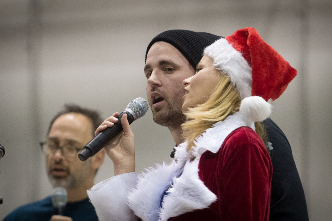 Major League Baseball player Heath Hembree sings "Take Me Out to the Ball Game" during a visit by the 2015 USO Holiday Tour to Bagram Airfield, Afghanistan, Dec. 8, 2015. DoD photo by D. Myles Cullen