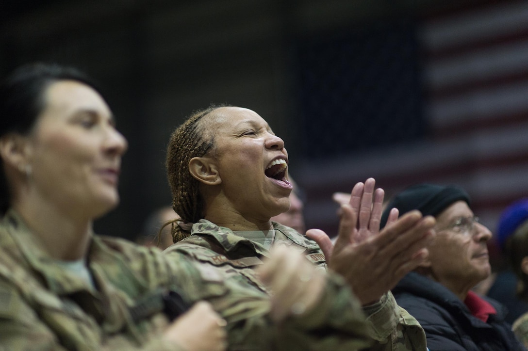 U.S. service members and civilians cheer during a performance by entertainers from the 2015 USO Holiday Tour at Bagram Airfield, Afghanistan, Dec. 8, 2015. DoD photo by D. Myles Cullen