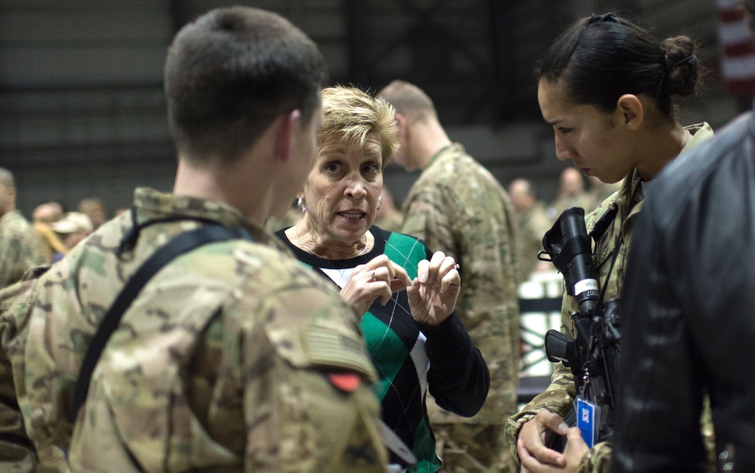 Ellyn Dunford, wife of Chairman of the Joint Chiefs of Staff Marine Corps Gen. Joseph F. Dunford, talks with U.S. soldiers during a USO visit on the flight line at Bagram Airfield, Afghanistan, Dec. 8, 2015. DoD photo by D. Myles Cullen