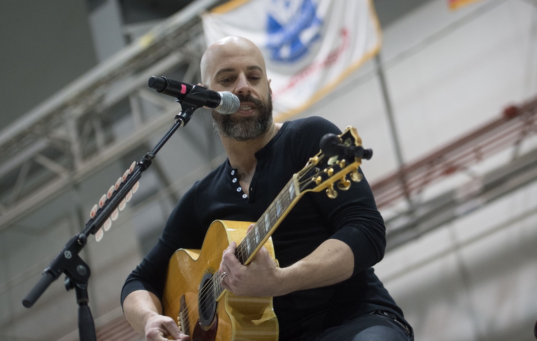 Musician Chris Daughtry performs in front of an audience of mostly U.S. service members during during a visit by the 2015 USO Holiday Tour to Bagram Airfield, Afghanistan, Dec. 8, 2015. DoD photo by D. Myles Cullen