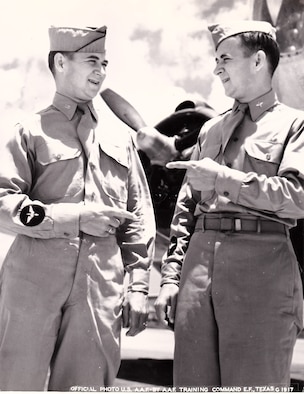 A vintage photo of retired Air Force Reserve Majs. Raymond “Glenn” Clanin and Russell “Lynn” Clanin during training in the Aviation Cadet program, prior to receiving their pilot wings in August 1944 at Ellington Field, Texas. Seventy-one years later, the 92-year-old twin brothers are recipients of the French government's highest distinction for their military service as World War II veterans, the Legion of Honor medal. (Courtesy photo/U.S. Army Air Forces, AAF Training Command)