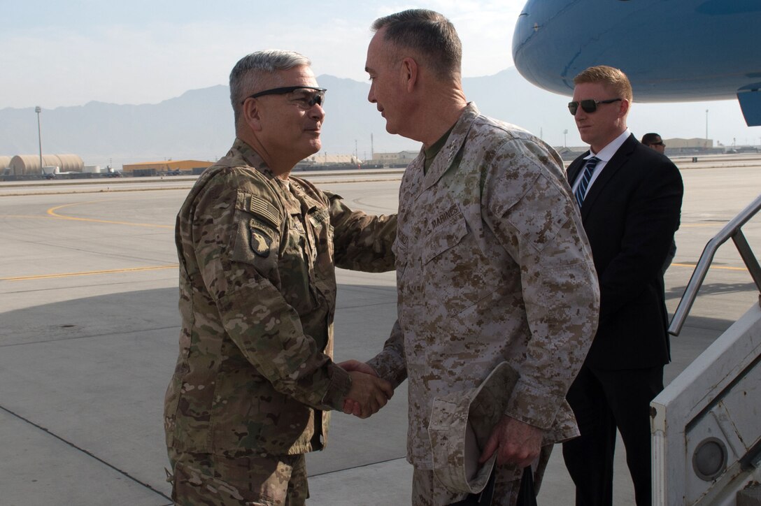 U.S. Army Gen. John F. Campbell, commander of U.S. Forces-Afghanistan and the Resolute Support Mission, greets U.S. Marine Corps Gen. Joseph F. Dunford Jr., chairman of the Joint Chiefs of Staff, as he arrives at Bagram Airfield, Afghanistan, Dec. 8, 2015.  Dunford was traveling along with entertainers from the 2015 USO Holiday Tour to visit deployed service members on three continents. DoD photo by D. Myles Cullen