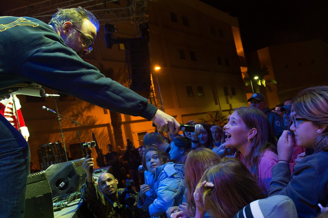 Comedian David Wain works the crowd at Naval Support Activity Bahrain, during a performance as part of the 2015 USO Holiday Tour, Dec. 7, 2015. DoD photo by D. Myles Cullen