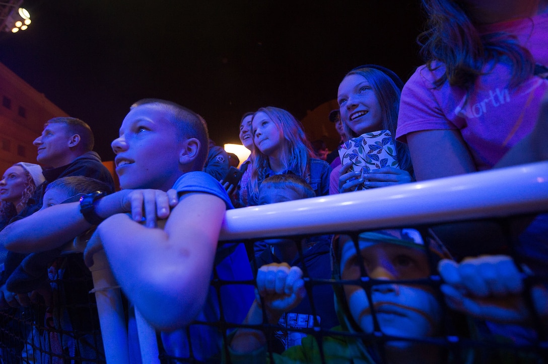 U.S. service members' children watch a performance by members of the 2015 USO Holiday Tour at Naval Support Activity Bahrain, Dec. 7, 2015. DoD photo by D. Myles Cullen