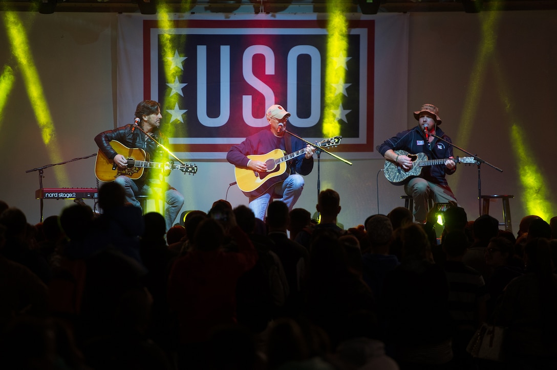From left, singer/songwriters Brett James and Billy Montana and country musician Kyle Jacobs perform for U.S. service members at Naval Support Activity Bahrain, during a stop by the 2015 USO Holiday Tour, Dec. 7, 2015. DoD photo by D. Myles Cullen