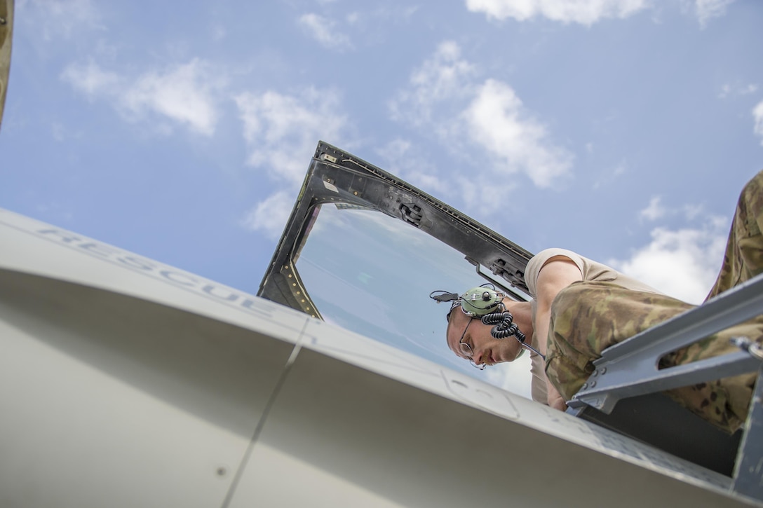 U.S. Air Force Staff Sgt. Brendan Lee climbs to the cockpit of an F-16 Fighting Falcon aircraft to troubleshoot a faulty radar module on Bagram Airfield, Afghanistan, Nov. 30, 2015. Lee is an avionics technician assigned to the 455th Expeditionary Aircraft Maintenance Squadron, deployed from Hill Air Force Base, Utah. U.S. Air Force photo by Tech. Sgt. Robert Cloys