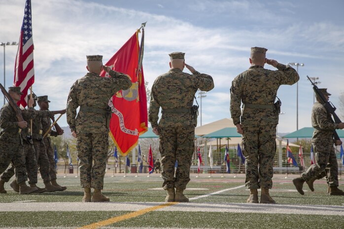 Headquarters Battalion leadership salute Marines performing a pass in review during a relief and appointment ceremony at Felix Field, Dec. 3, 2015. Sgt. Maj. Abel T. Leal passed on his post as sergeant major of Headquarters Battalion to Sgt. Maj. Avery L. Crespin. (Official Marine Corps photo by Pfc. Allie Jesse/Released)