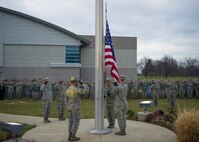 Airmen from the National Air and Space Intelligence Center Color Guard lower the flag during a retreat ceremony, 74 years after the attack on Pearl Harbor at Wright-Patterson Air Force Base, Ohio, Dec. 7, 2015. The retreat ceremony serves a twofold purpose it signals the end of the official duty day and serves as a ceremony for paying respect to the United States flag. (U.S. Air Force Photo by Senior Airman Justyn M. Freeman)   
