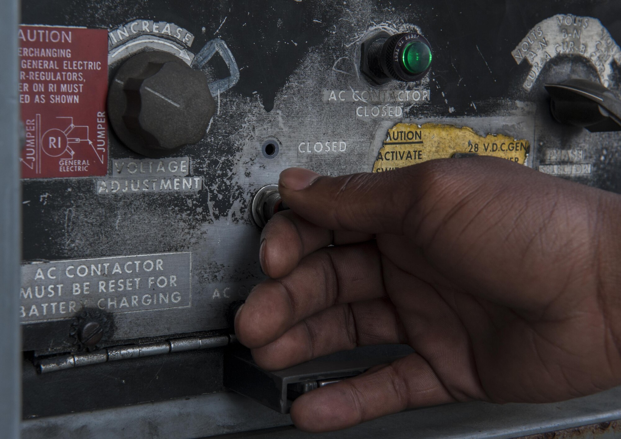 U.S. Air Force Airman Marqrell Ervin, 67th Aircraft Maintenance Unit avionics technician apprentice, shuts down the power cart being used during an operations check, Dec. 8, 2015, at Kadena Air Base, Japan. The power cart has allowed maintainers to perform necessary repairs and tests without the need to start the engines, saving the Air Force thousands of dollars each year. (U.S. Air Force photo by Airman Zackary A. Henry)