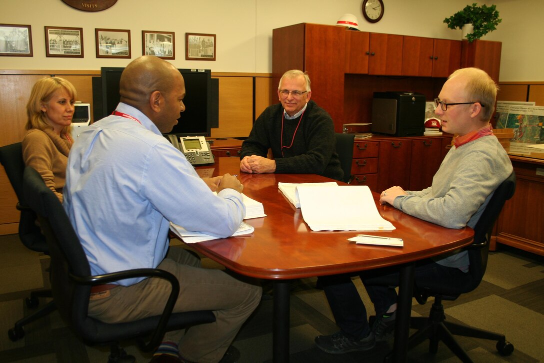 Omaha District architects, Karen Jarvis, Askelon Parker (left) and Andy Temeyer (right) sat down with Northwestern Division Military Construction program manager Dave Packard to talk about design projects at Fort Carson, Colorado.