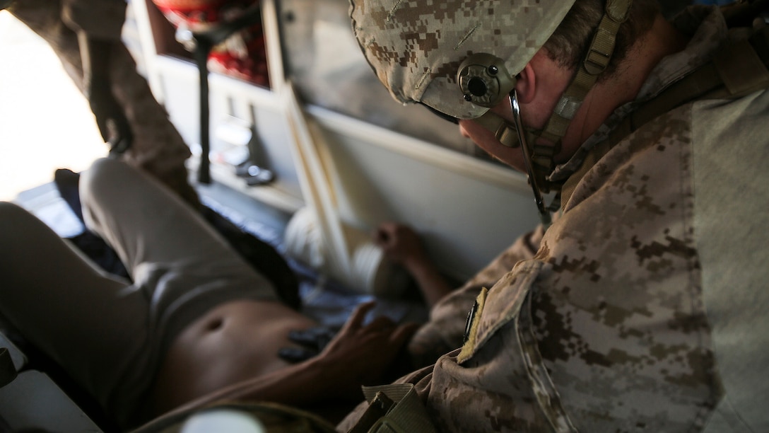 U.S. Navy Petty Officer 3rd Class Bryan Rileysilva, a hospitalman with Company B, 1st Battalion, 7th Marine Regiment, Special Purpose Marine Air Ground Task Force – Crisis Response – Central Command, treats an Iraqi soldier for combat-related injuries, Iraq, Nov. 28, 2015. Wounded Iraqi soldiers are occasionally transported from battlefields in Ramadi and Fallujah, Iraq, to Al Taqaddum to receive medical treatment from U.S. personnel. U.S. Navy corpsmen with “Bravo” Company, 1st Bn., 7th Marines, are the first responders to attend to the casualties. U.S. Marines and sailors with SPMAGTF-CR-CC are currently deployed in support of the Combined Joint Task Force - Operation Inherent Resolve mission.  