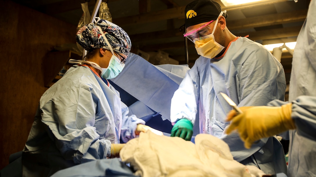 Members of the U.S. Army 772nd Forward Surgical Team and 115th Combat Support Hospital, attached to Task Force Al Taqaddum, Combined Joint Force Land Component Command-Iraq perform surgery on an Iraqi soldier injured in combat, Nov. 28 2015. Wounded Iraqi soldiers are occasionally transported from battlefields in Ramadi and Fallujah, Iraq, to Al Taqaddum to receive medical treatment from U.S. personnel. These personnel are currently deployed in support of Combined-Joint Task Force - Operation Inherent Resolve, a multinational coalition of military forces who have joined to defeat the Islamic State of Iraq and the Levant. 