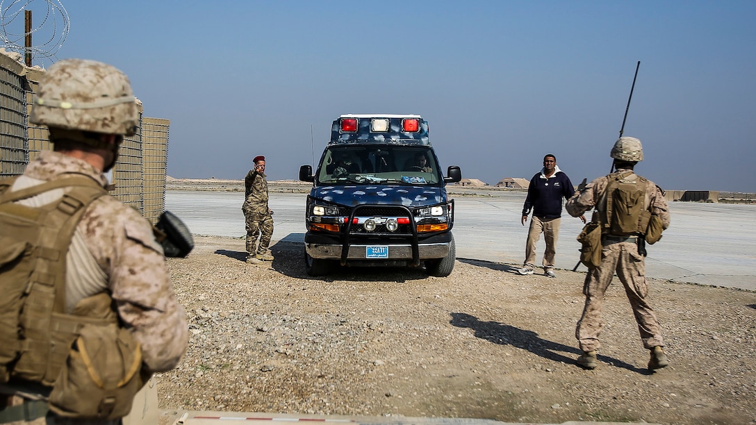 U.S. Marines with Company B, 1st Battalion, 7th Marine Regiment, Special Purpose Marine Air Ground Task Force – Crisis Response – Central Command, prepare to search an ambulance carrying an injured Iraqi soldier at Al Taqaddum, Iraq, Nov. 28, 2015. Wounded Iraqi soldiers are occasionally transported from battlefields in Ramadi and Fallujah, Iraq, to Al Taqaddum to receive medical treatment from U.S. personnel. U.S. Navy corpsmen with “Bravo” Company, 1st Bn., 7th Marines, are the first responders to attend to the casualties. U.S. Marines and sailors with SPMAGTF-CR-CC are currently deployed in support of Combined Joint Task Force - Operation Inherent Resolve, which focuses on enabling Iraqi forces to counter ISIL, reestablish Iraq’s borders and retake lost terrain thereby restoring regional stability and security. 

 