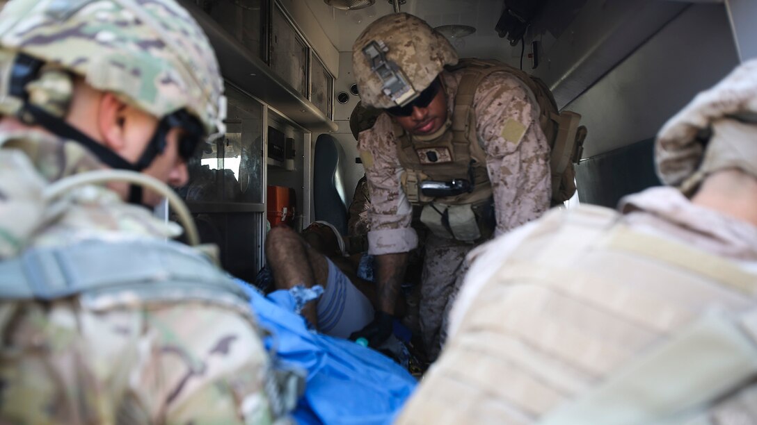 U.S. Navy Seaman Apprentice Mikail Garib, a hospitalman with Company B, 1st Battalion, 7th Marine Regiment, Special Purpose Marine Air Ground Task Force – Crisis Response – Central Command, prepares an Iraqi soldier with combat-related injuries for transport into the 115th Combat Support Hospital at Al Taqaddum, Iraq, Nov. 28, 2015. Wounded Iraqi soldiers are occasionally transported from battlefields in Ramadi and Fallujah, Iraq, to Al Taqaddum to receive medical treatment from U.S. personnel. U.S. Navy corpsmen with “Bravo” Company, 1st Bn., 7th Marines, are the first responders to attend to the casualties. U.S. Marines and sailors with SPMAGTF-CR-CC are currently deployed in support of Combined Joint Task Force - Operation Inherent Resolve, which focuses on defeating the Islamic State of Iraq and Levant in the U.S. Central Command area of responsibility. 
