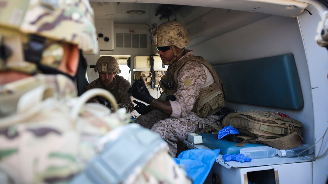 U.S. Navy corpsmen with Company B, 1st Battalion, 7th Marine Regiment, Special Purpose Marine Air Ground Task Force – Crisis Response – Central Command, treat an Iraqi soldier for combat-related injuries at Al Taqaddum, Iraq, Nov. 28, 2015. Wounded Iraqi soldiers are occasionally transported from battlefields in Ramadi, Iraq, to Al Taqaddum to receive medical treatment from U.S. personnel. U.S. Marines and sailors with SPMAGTF-CR-CC are currently deployed in support of Combined Joint Task Force - Operation Inherent Resolve, which focuses on defeating the Islamic State of Iraq and Levant in the U.S. Central Command area of responsibility. 
