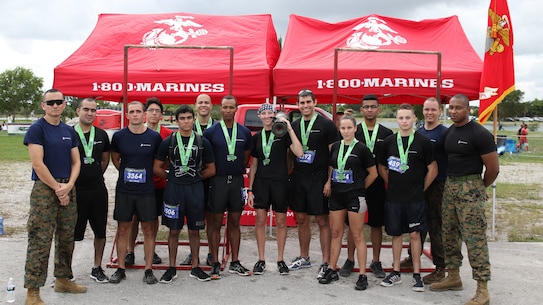The Officer Selection Team Miami pose for a photo with their Officer Candidates Nov. 21, 2015 at the BattleFrog Race Series in Miami, Fla. (U.S. Marine Corps photo by Sgt. Michael Lopez)