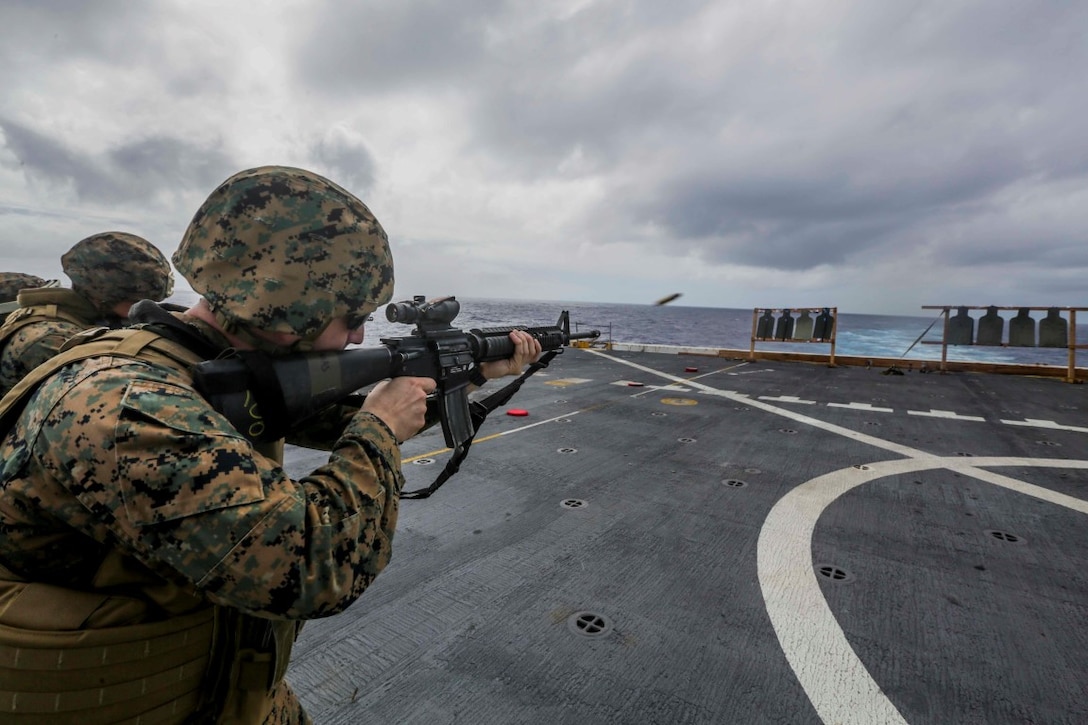 PACIFIC OCEAN (Dec. 2, 2015) U.S. Marine Cpl. Terry Christmas fires an M16 rifle during a deck shoot aboard the USS Anchorage (LPD 23).  Christmas is an avionics technician with Marine Medium Tiltrotor Squadron 161 (Reinforced), 15th Marine Expeditionary Unit.  The 15th MEU is currently returning from a routine seven-month deployment to the US Pacific and Central Command areas of responsibility. (U.S. Marine Corps photo by Sgt. Jamean Berry/Released)