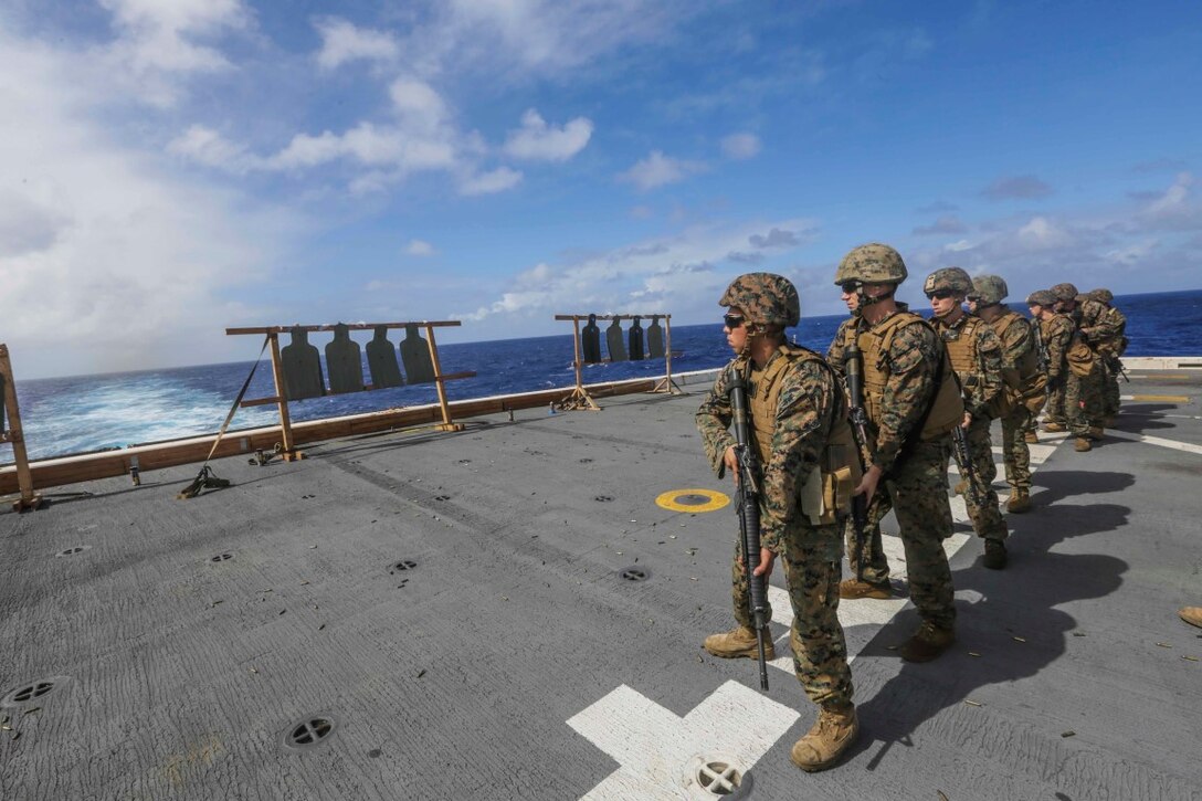 PACIFIC OCEAN (Dec. 2, 2015) U.S. Marines with Marine Medium Tiltrotor Squadron 161 (Reinforced), 15th Marine Expeditionary Unit, practice pivot drills during a deck shoot  aboard the USS Anchorage (LPD 23).  The 15th MEU is currently returning from a routine seven-month deployment to the US Pacific and Central Command areas of responsibility. (U.S. Marine Corps photo by Sgt. Jamean Berry/Released)