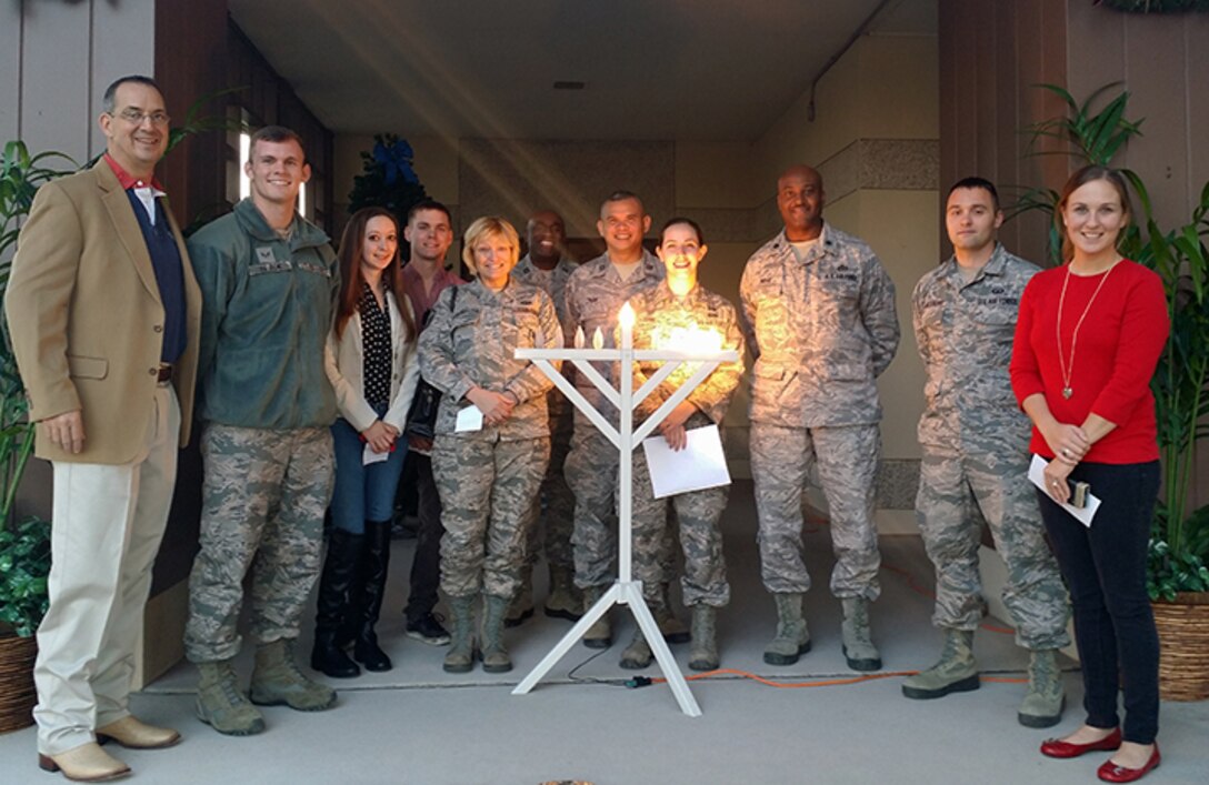 The Laughlin Chapel team and members of Laughlin pose for a photo after lighting the Menorah on Laughlin Air Force Base, Texas, Dec. 7, 2015. The Menorah is a candelabrum lit during the eight-day holiday of Hanukkah. (Courtesy photo)