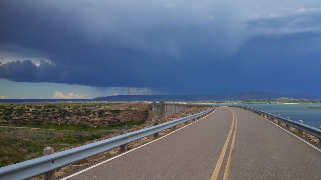 CONCHAS LAKE, N.M. – The beginning of a huge storm moving into the area, June 1, 2015, as seen from atop Conchas Dam. Hooverville has not yet received any rain but Big Mesa is already being hit with rain.  Photo by Valerie Mavis. 