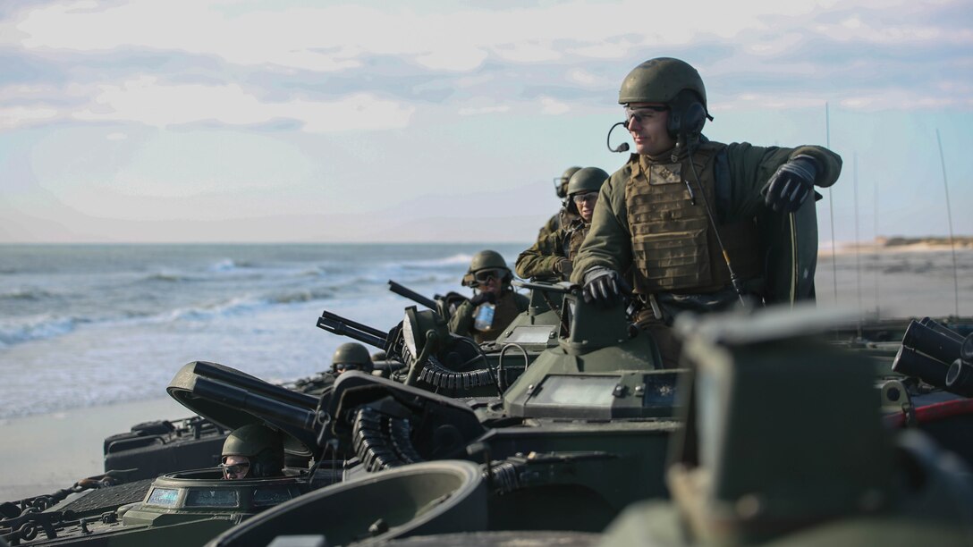 A Marine with Alpha Company, 2nd Assault Amphibian Battalion, awaits the order to lock down the hatches as the unit prepares to conduct company-level beach operations on Marine Corps Base Camp Lejeune, N.C. Dec. 5, 2015. During this exercise the unit conducted maneuvers as a mechanized infantry company in preparation for upcoming operations.