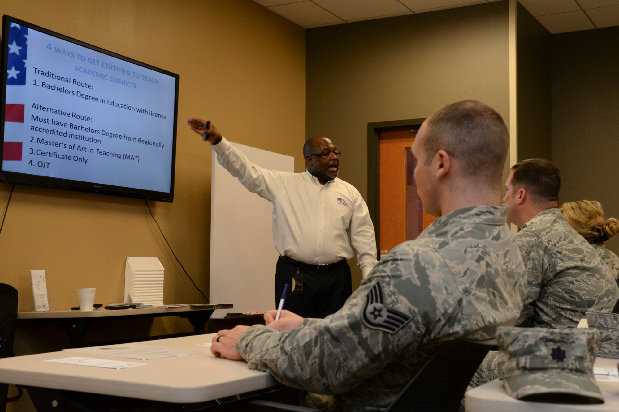 Don Howard, Louisiana and Arkansas Troops to Teachers regional director, briefs during a seminar at Barksdale Air Force Base, La., Dec. 9, 2015. The program provides services to include information on the process of obtaining a teaching license and job placement assistance. (U.S. Air Force photo/Senior Airman Jannelle Dickey)