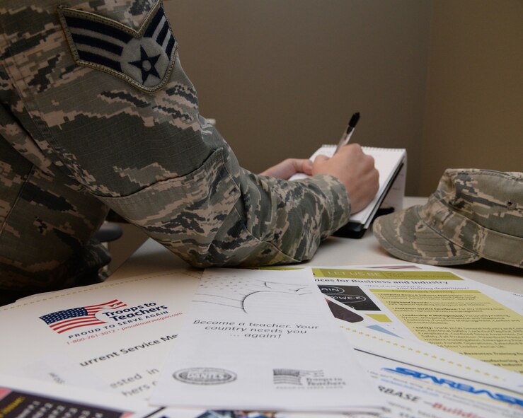 Senior Airman Amanda Morris, 2nd Bomb Wing Public Affairs photojournalist journeyman, takes notes during a Troops to Teachers seminar at Barksdale Air Force Base, La., Dec 9, 2015. Attendees received additional resources to assist them in pursuing a career in education after finishing their military commitment. (U.S. Air Force photo/Senior Airman Jannelle Dickey)