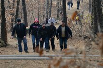 Airmen of Team Osan hike together in a forest to build their physical resiliency during Resilent Airman Day, Dec. 7, 2015, near Osan Air Base, Republic of Korea. In addition to physical activities, Airmen participated in small-group discussions to strengthen their mental, emotional and spiritual resiliency. (U.S. Air Force photo/Airman 1st Class Dillian Bamman)