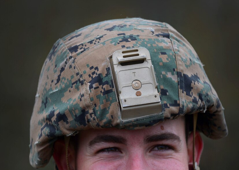 A U.S. Marine assigned to the 273rd Marine Wing Support Squadron assists with putting up a communications tower to prepare for an exercise at Poinsett Electronic Combat Range, Wedgefield, S.C., Dec. 7, 2015. For the week long exercise, the Marines set up sleeping tents, communication systems, and a chow hall to simulate a deployed environment. (U.S. Air Force photo by Senior Airman Michael Cossaboom)