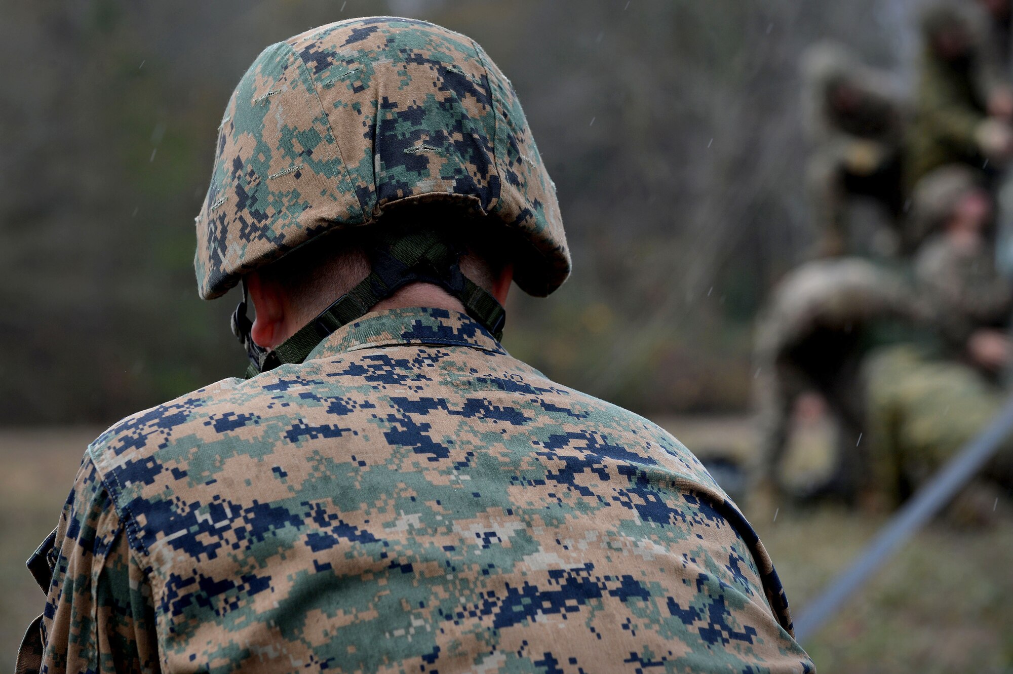 A U.S. Marine assigned to the 273rd Marine Wing Support Squadron pulls a rope tight, securing a communications tower to prepare for an exercise at Poinsett Electronic Combat Range, Wedgefield, S.C., Dec. 7, 2015. The Marines were a part of the setup team preparing for a week long exercise. (U.S. Air Force photo by Senior Airman Michael Cossaboom)